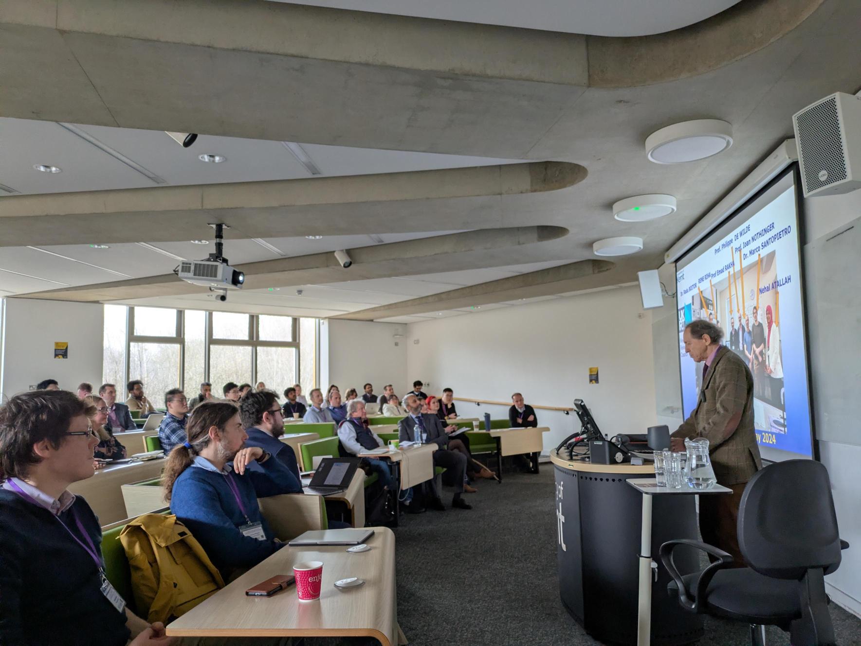 speaker and a room full of people